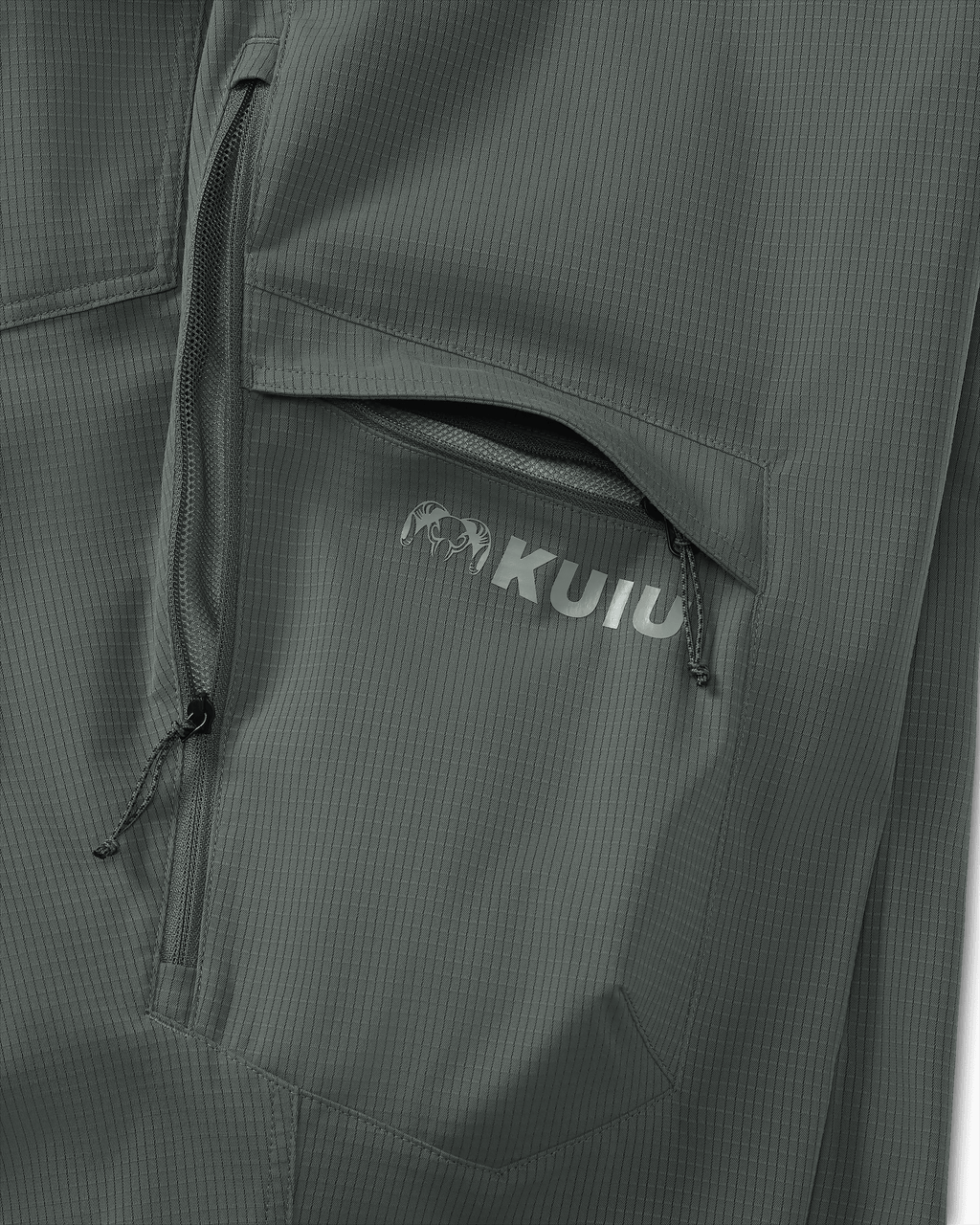 Detail of partially open hip vent and open cargo pocket on Women's Tiburon Pant in Stone Grey