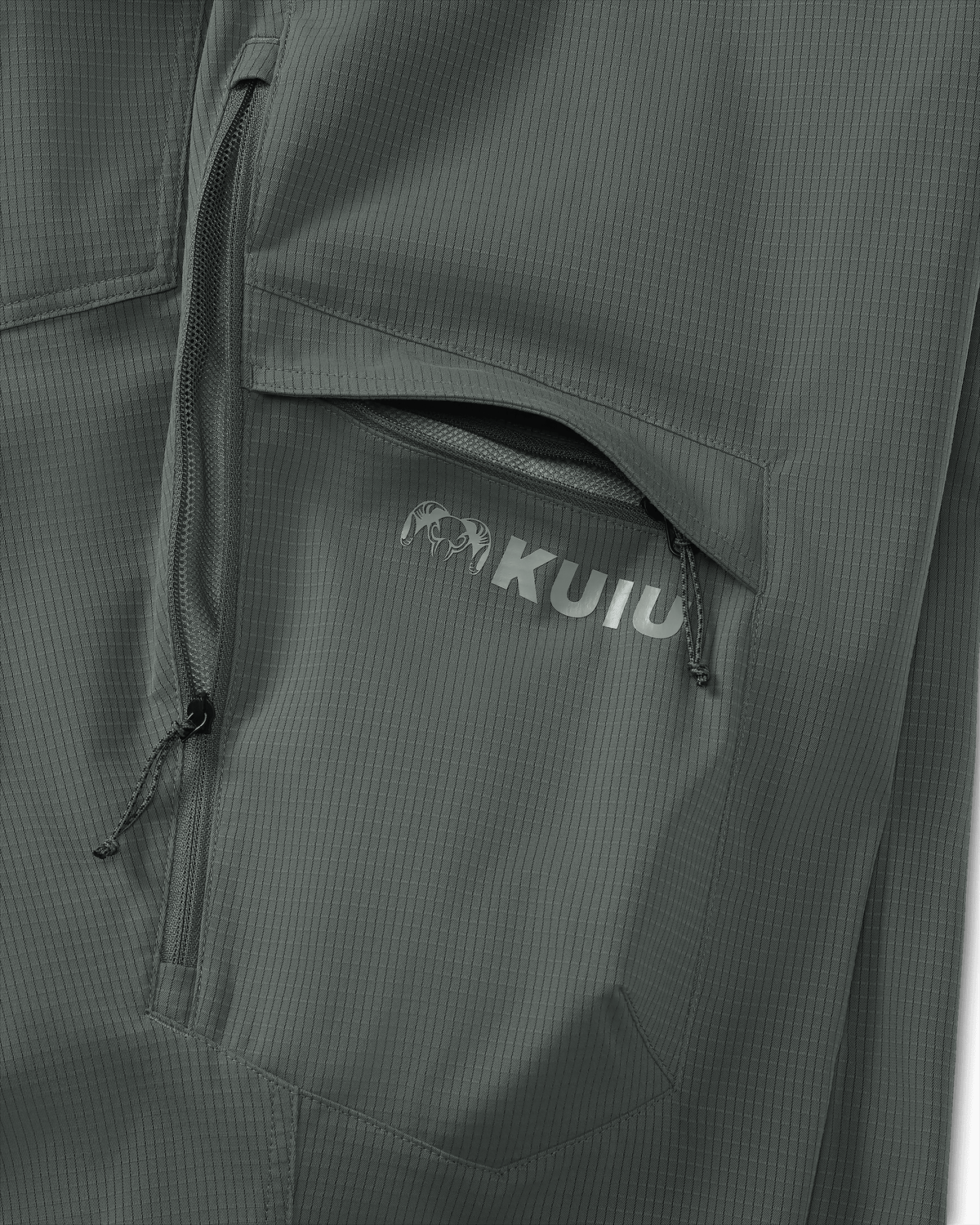 Detail of partially open hip vent and open cargo pocket on Women's Tiburon Pant in Stone Grey