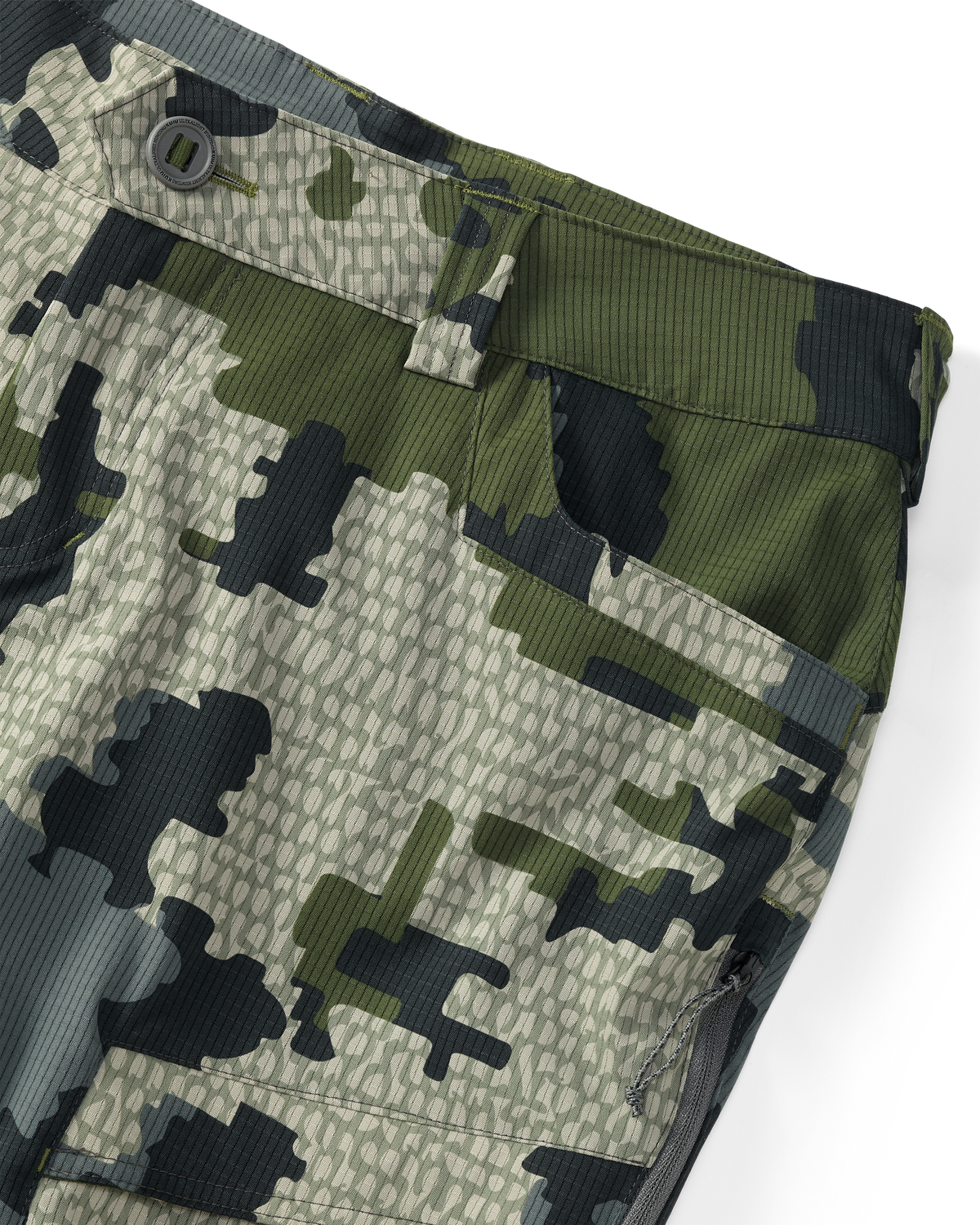 Detail of button and hand pocket on Women's Tiburon Pant in Verde Camouflage
