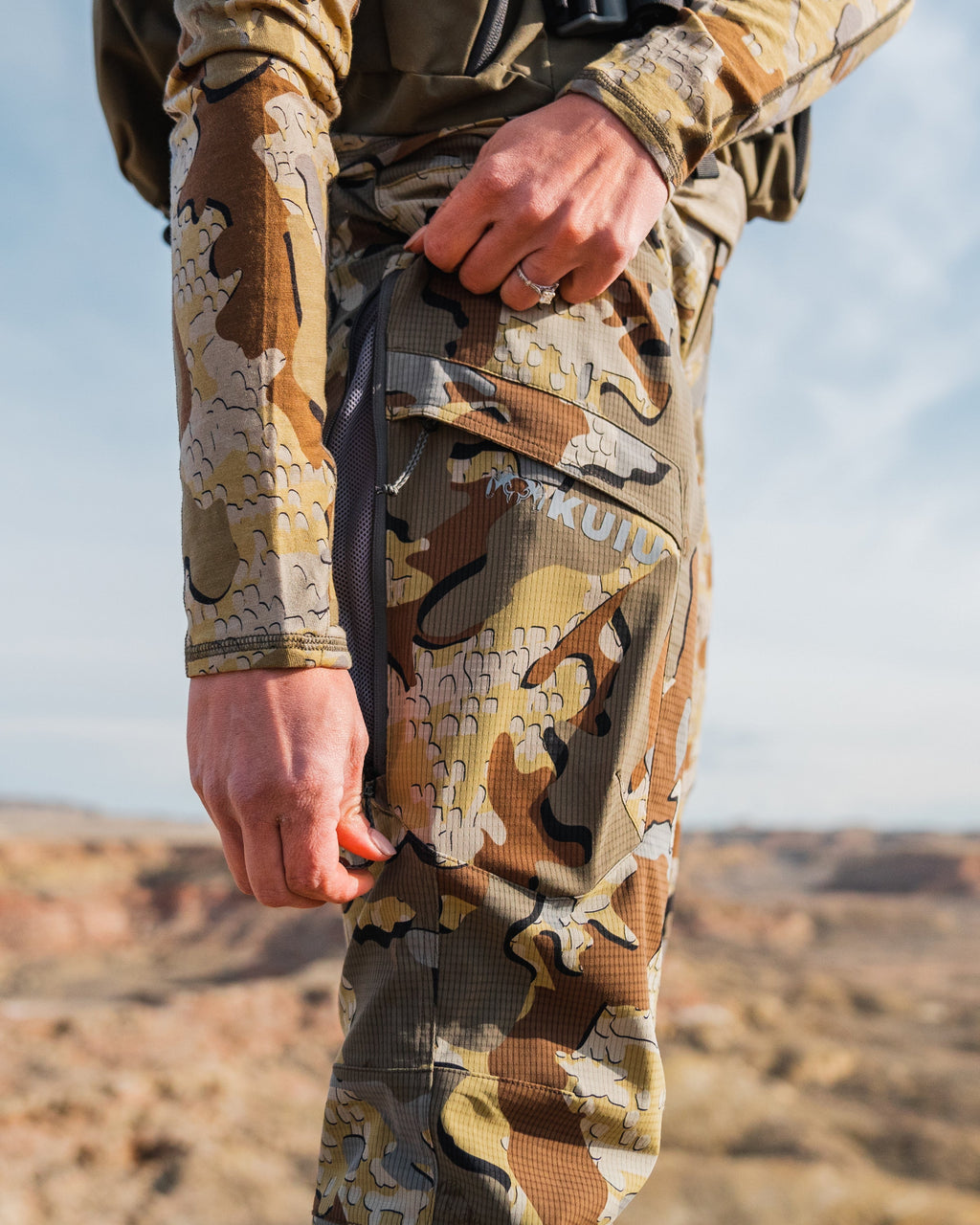 Side detail female hunter opening hip vent on Women's Tiburon Pant in Valo Camouflage