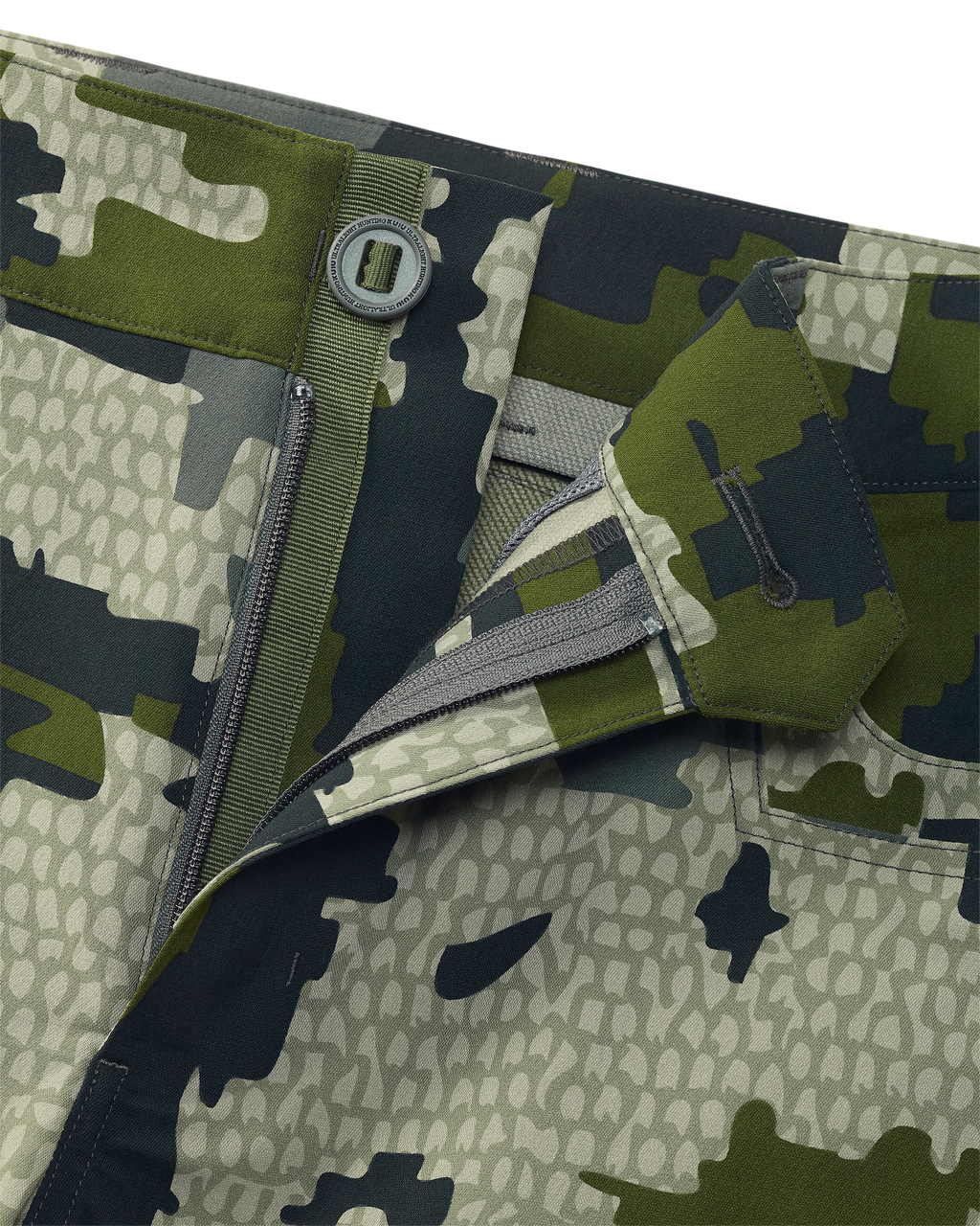 Close-up of open fly front zipper and button on Women's Kutana Stretch Woven Pant in Verde Camouflage