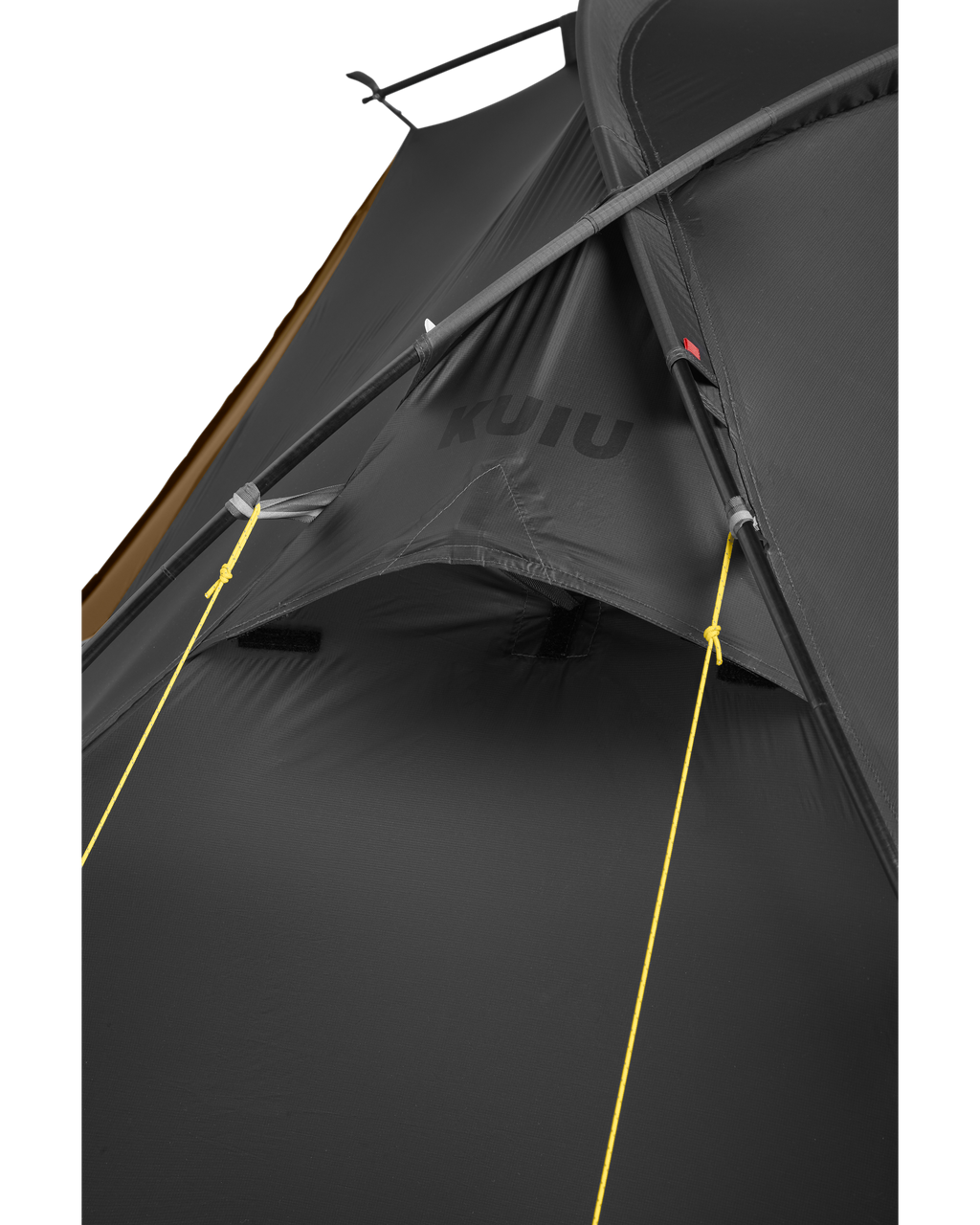 Detailed tent exterior of rain fly and tent body connected together with two guy lines wrapped on tent poles