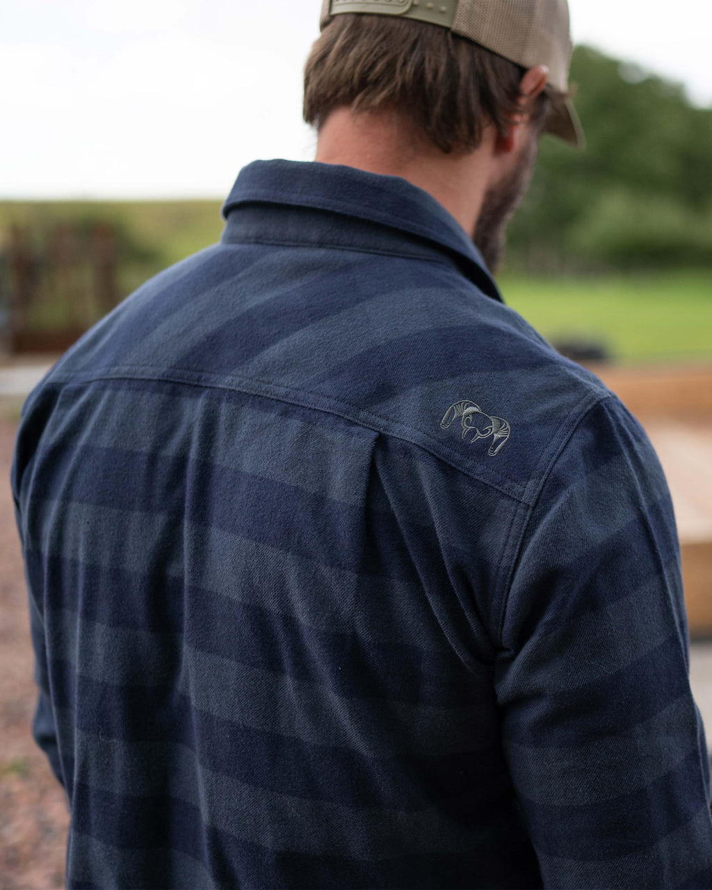 Logo on back shoulder of the Field Flannel Shirt in Steel Blue Buffalo Check