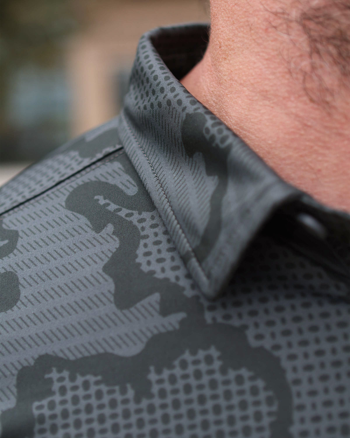 Close-up view of collar on KUIU Performance Polo T-Shirt in Gunmetal Grey Tonal Print