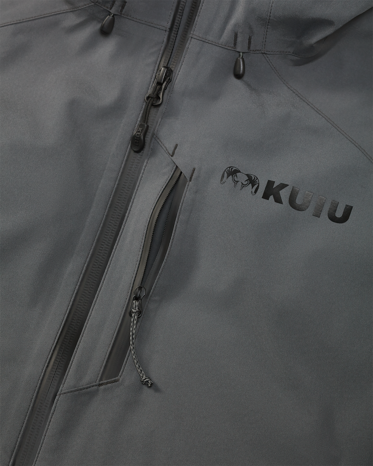 Close-up detail of front zipper and vertical zippered chest pocket on the Northridge Rain Jacket in Gunmetal Grey