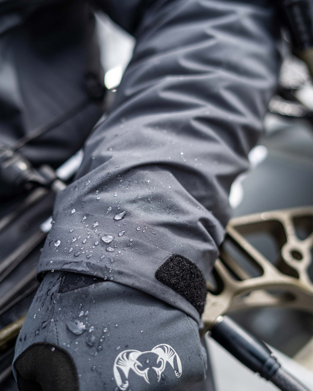 Close-up detail of water droplets on the cuffs of the Northridge Rain Jacket in Gunmetal Grey
