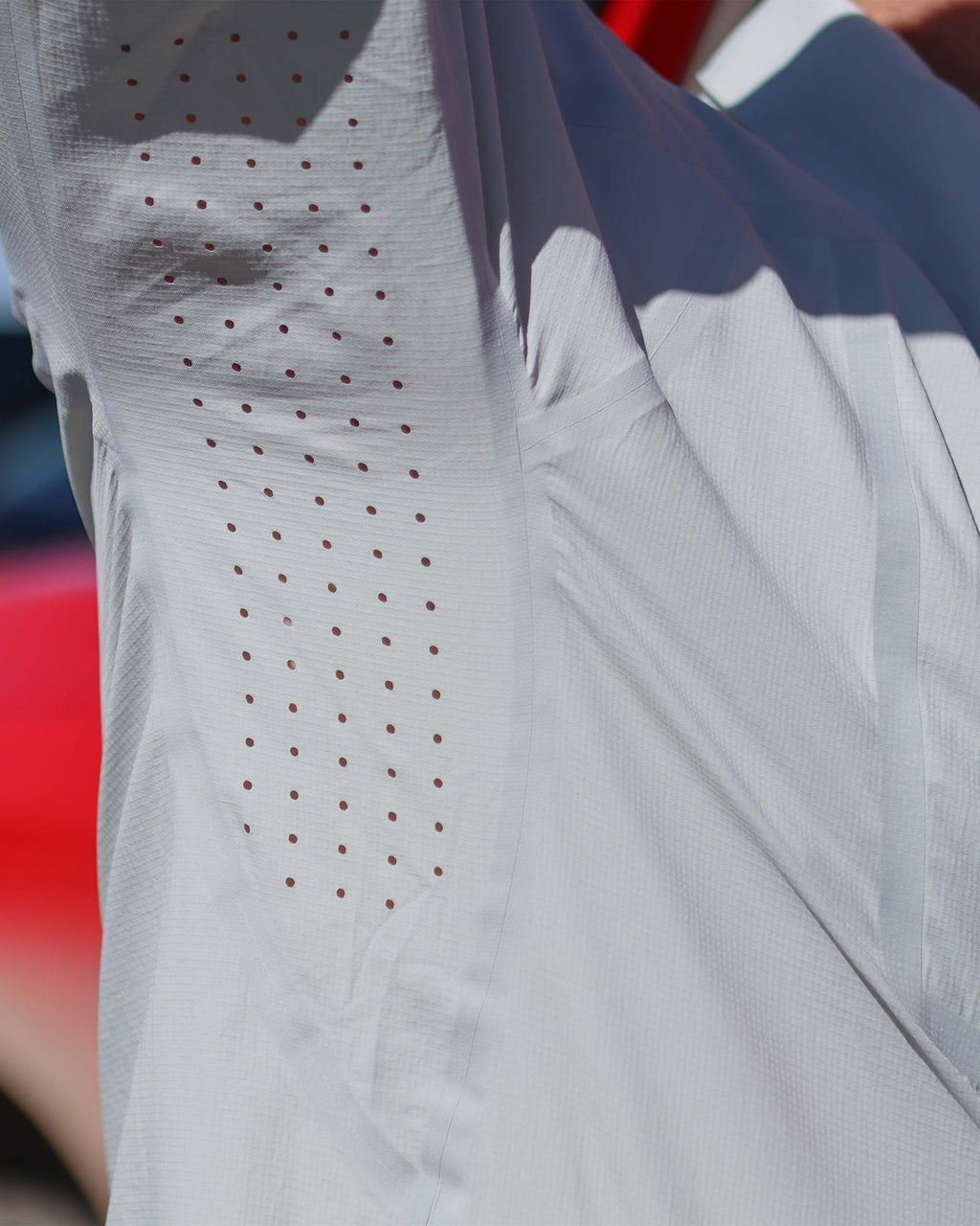 Close-up of underarm perforated, laser cut vents on the Salton Long Sleeve Shirt in Lunar Grey