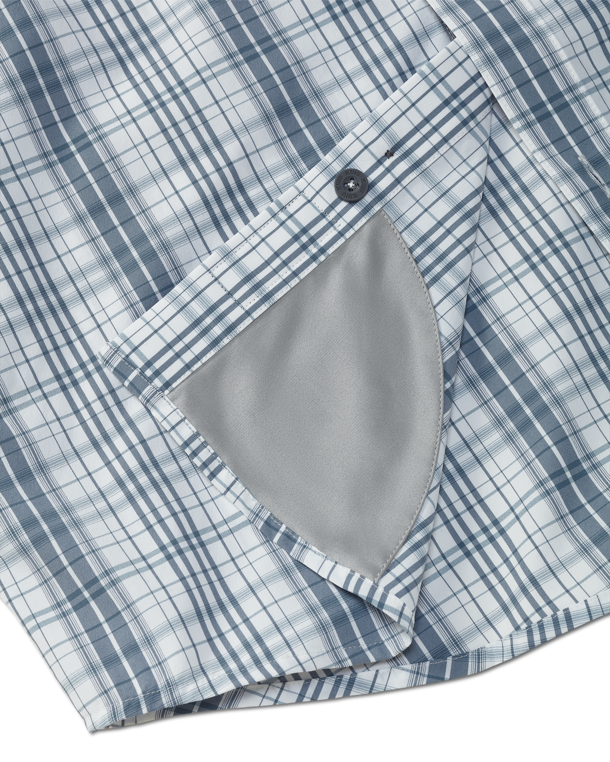Detail view of integrated micro-fiber lens cleaning cloth patch sewn on the inside lower hem of the Borrego LS Shirt in Blueish Grey Granite Plaid