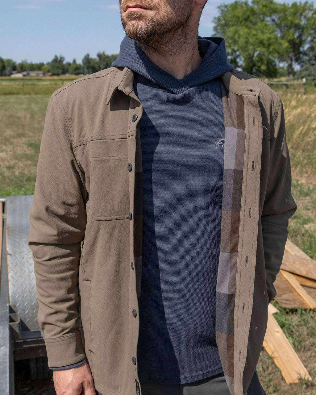 Man wearing Motive Flannel Lined Shirt Jacket in Major Brown, highlighting interior flannel lining 