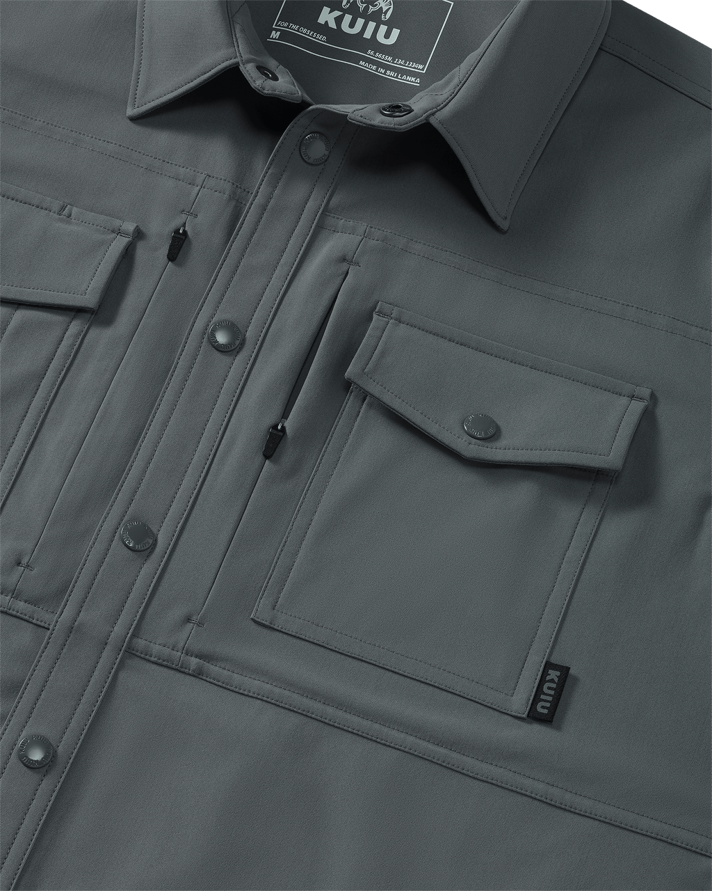 Close-up of chest pocket and vertical zipped pocket on Tour Shirt Jacket in Castle Rock Grey