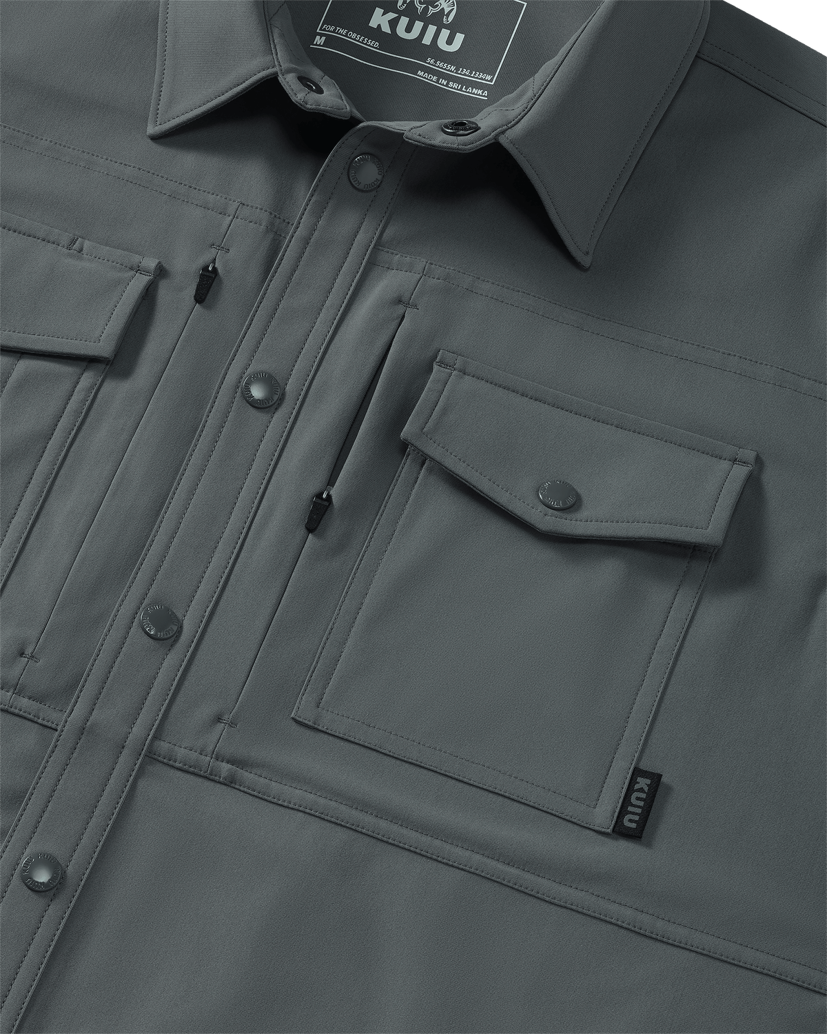 Close-up of chest pocket and vertical zipped pocket on Tour Shirt Jacket in Castle Rock Grey