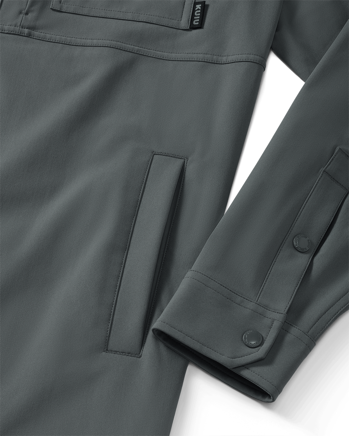 Close-up of hand pocket and snap closure on sleeve and cuff on Tour Shirt Jacket in Castle Rock Grey