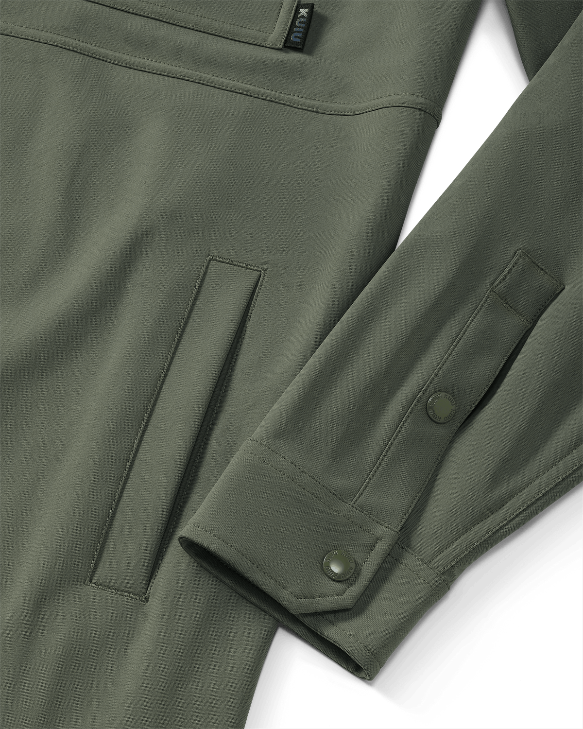 Close-up of hand pocket and snap closure on sleeve and cuff on Tour Shirt Jacket in Dark Sage