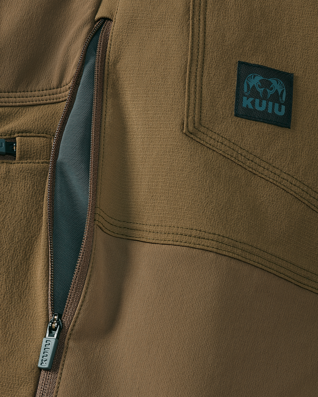 Close-up of hip-zips with lightweight mesh lining for ventilation on the Groundwork Stretch Woven Pant in Tobacco Brown