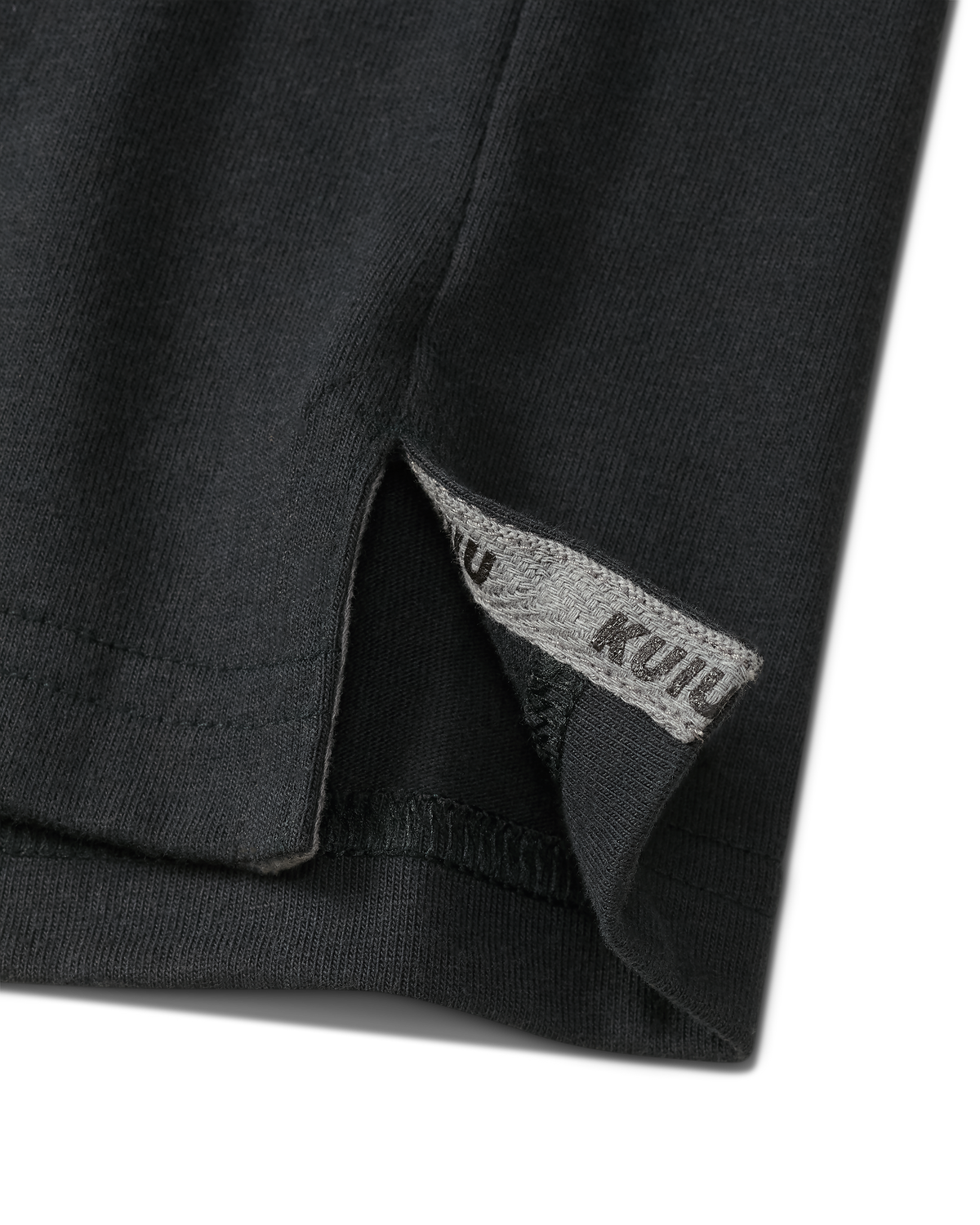 Close-up of split hem with sewn in KUIU label on the Workgrade SS Pocket Crew in Black