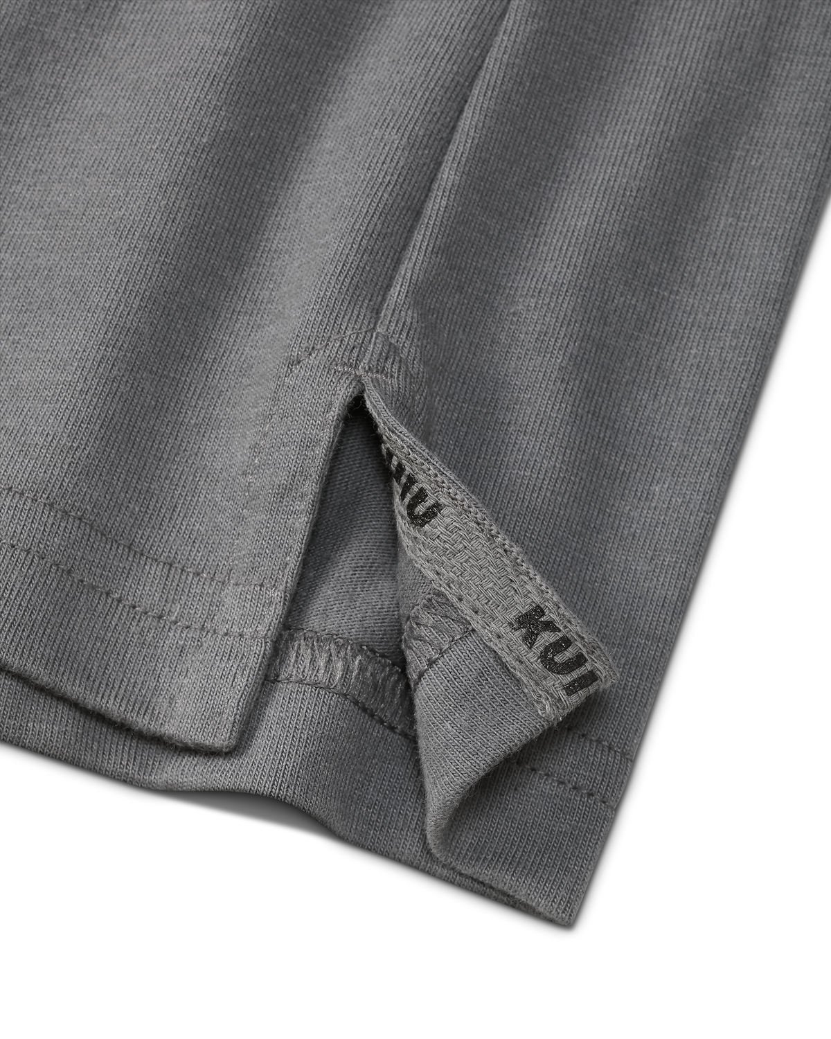 Close-up of split hem with sewn in KUIU label on the Workgrade SS Pocket Crew in Castle Rock Grey