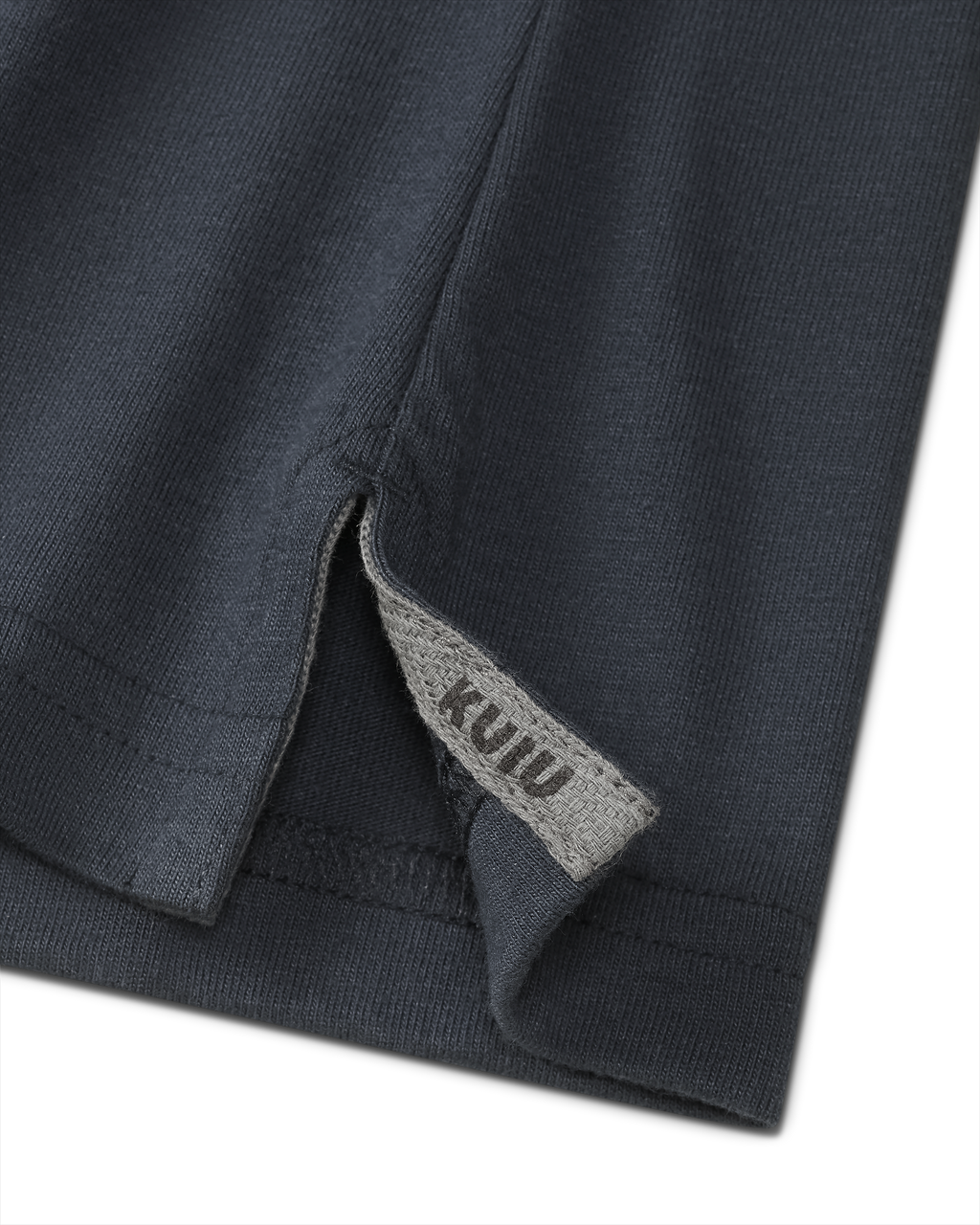 Close-up of split hem with sewn in KUIU label on the Workgrade SS Pocket Crew in Steel Blue