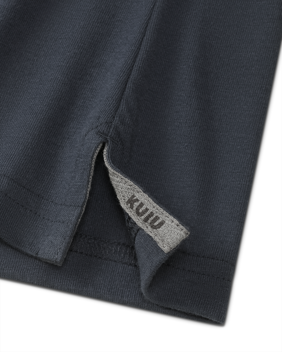 Close-up of split hem with sewn in KUIU label on the Workgrade SS Pocket Crew in Steel Blue