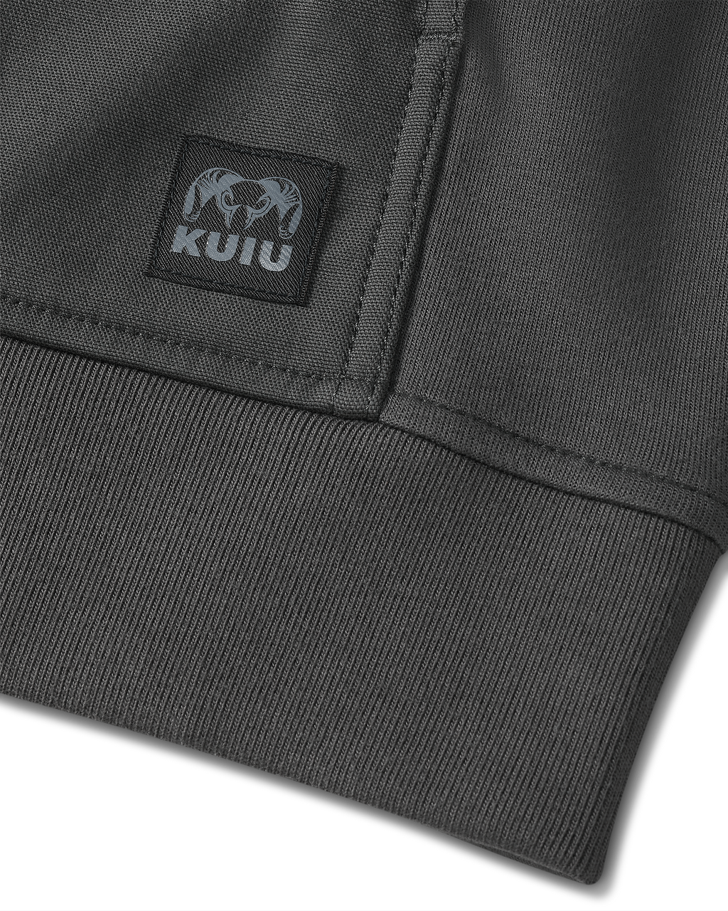 Detail of sewn-on KUIU logo patch located on the bottom of Workgrade Utility Hoodie in Asphalt Grey