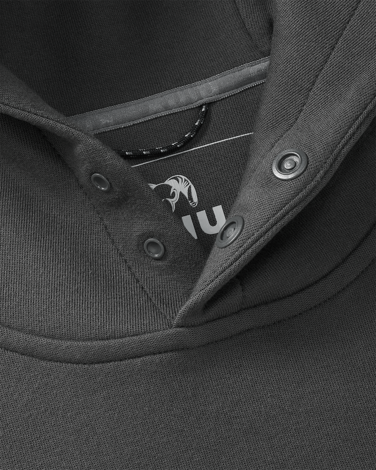Detail of front snap-fit buttons, free of drawcords, on the Workgrade Utility Hoodie in Asphalt Grey