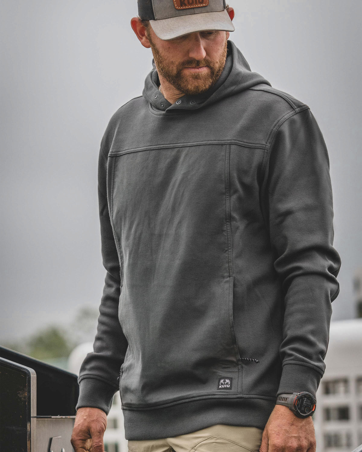 Front angled view of man wearing Workgrade Utility Hoodie in Asphalt Grey