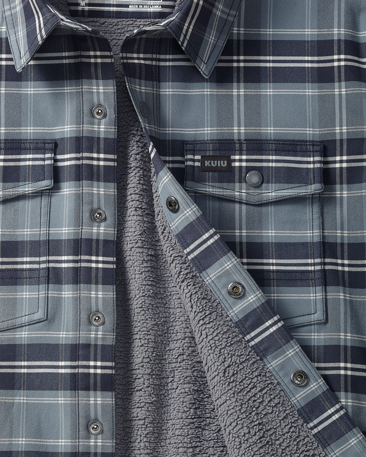 Detail image showing the interior fleece and snap-front buttons on Fleece Lined Flannel Shirt Jacket in Steel Blue Framework.
