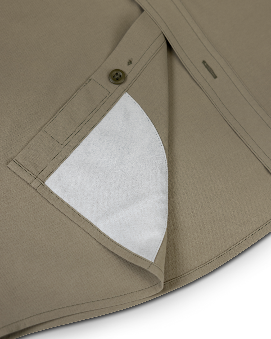Detail view of integrated micro-fiber lens cleaning cloth patch sewn on the inside lower hem of the Gauge Short Sleeve and Long Sleeve Workshirts.
