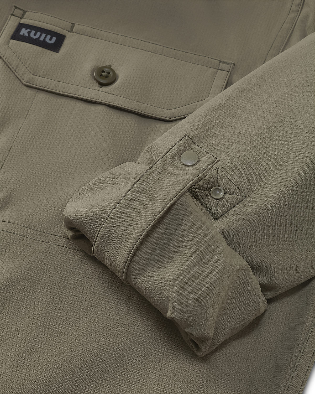 Close-up of rolled-up sleeve with button cuff retention strap on the Gauge Long Sleeve Workshirt in Khaki
