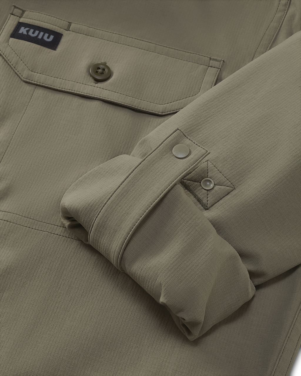 Close-up of rolled-up sleeve with button cuff retention strap on the Gauge Long Sleeve Workshirt in Khaki
