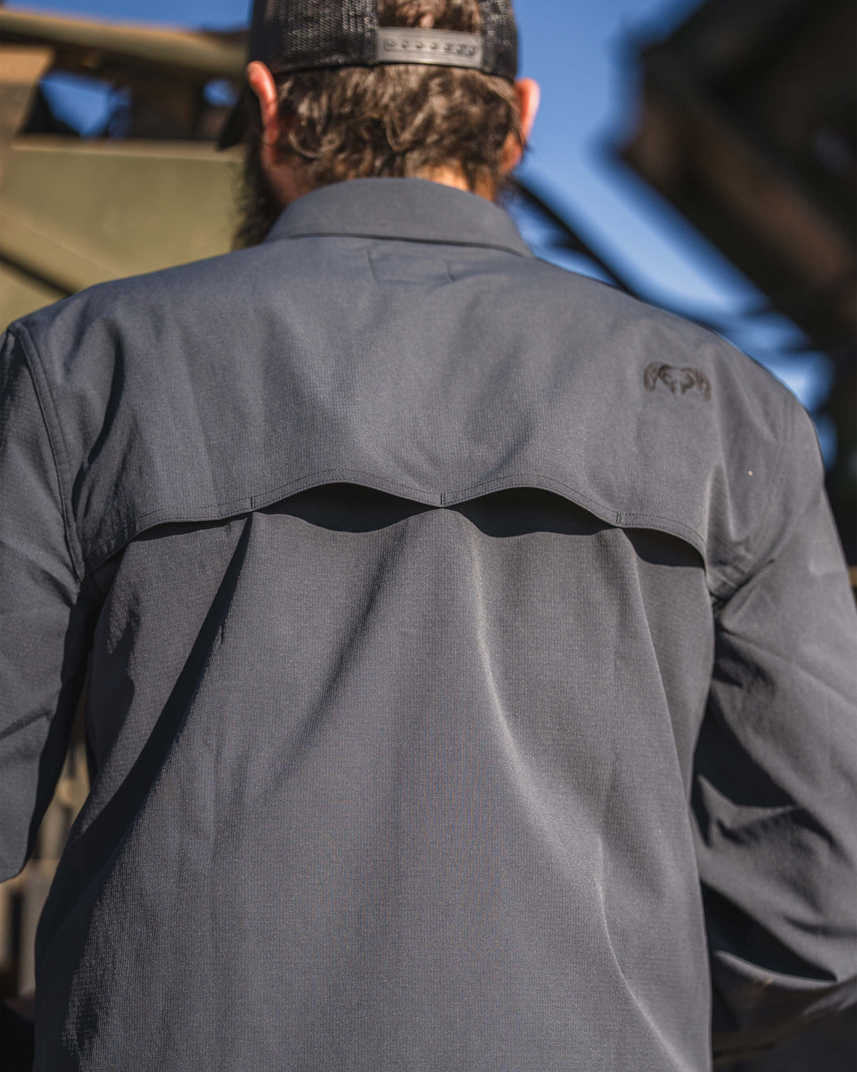 Back view of yoke venting with mesh liner for superior airflow on the Gauge Short Sleeve Work Shirt in Nightfall Blue.