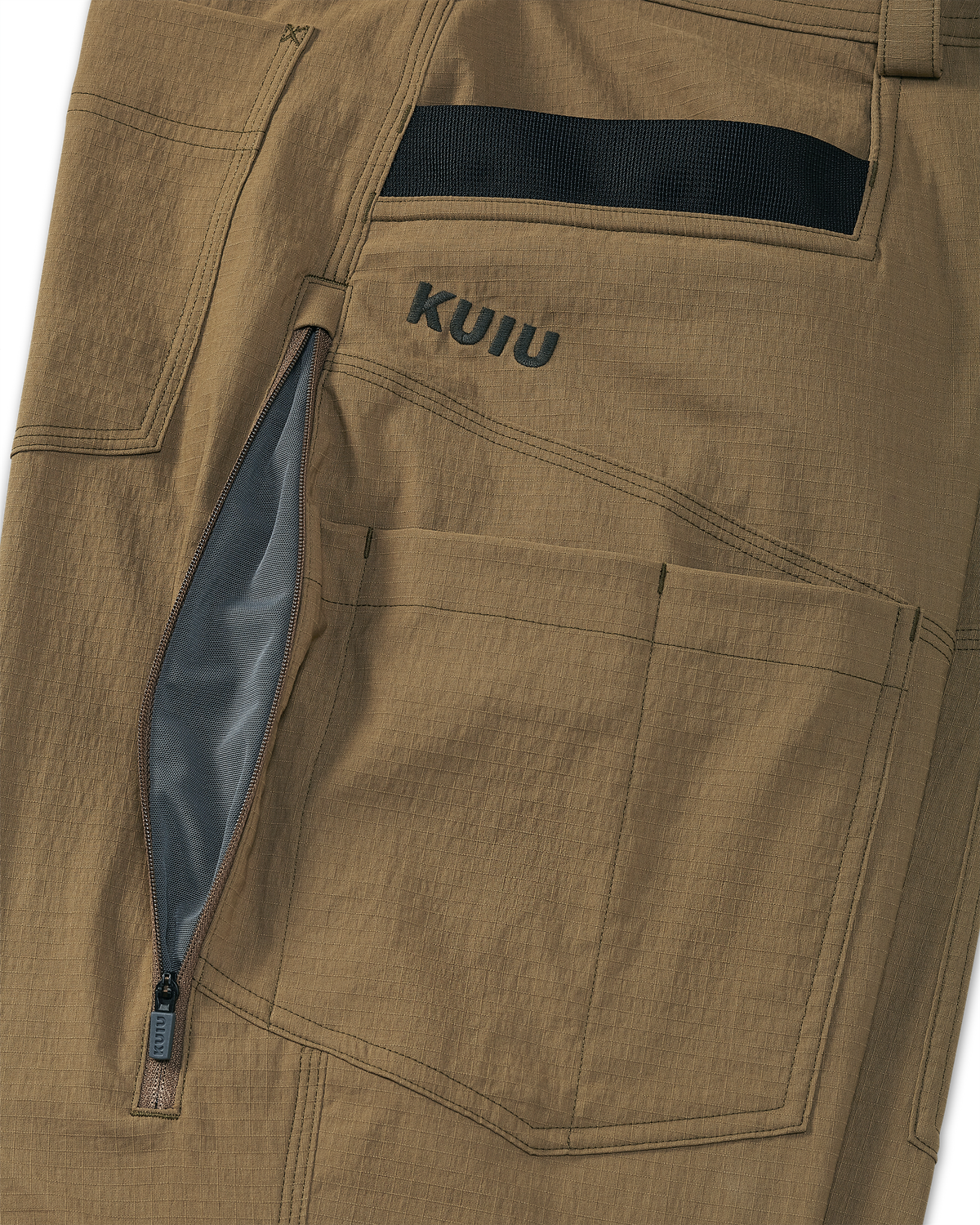 Close-up of hip-zips with lightweight mesh lining for ventilation on the Motive Workgrade Pant t in Tobacco Brown