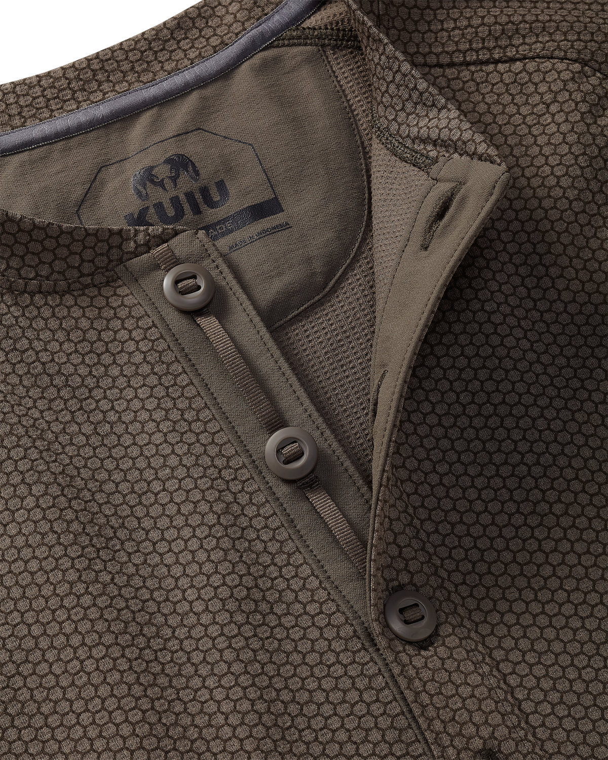 Close-up of Dura-Knit Henley in Rodeo Brown featuring slot-button placket construction with a buttoned collar and visible KUIU WORKGRADE neck label.