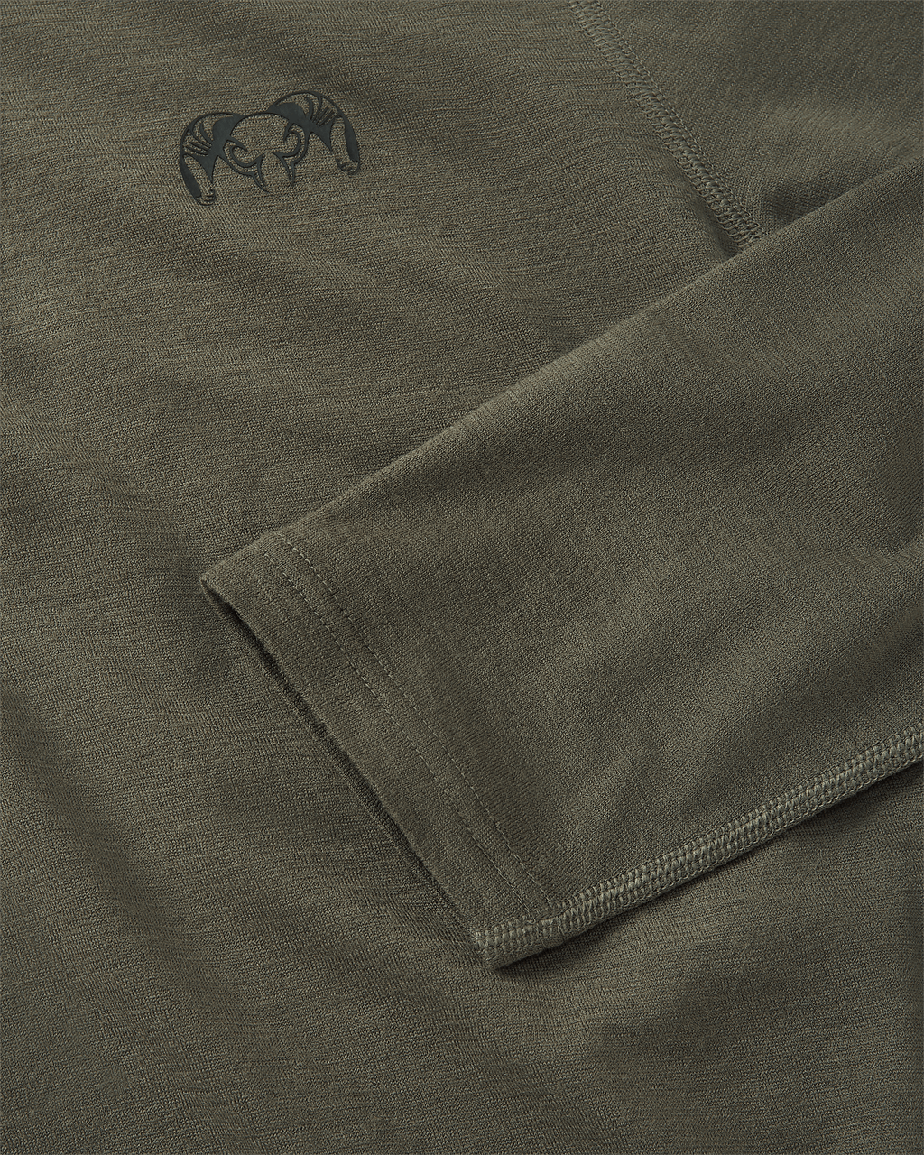 KUIU logo on the top left chest and flatlock stitching details on sleeve