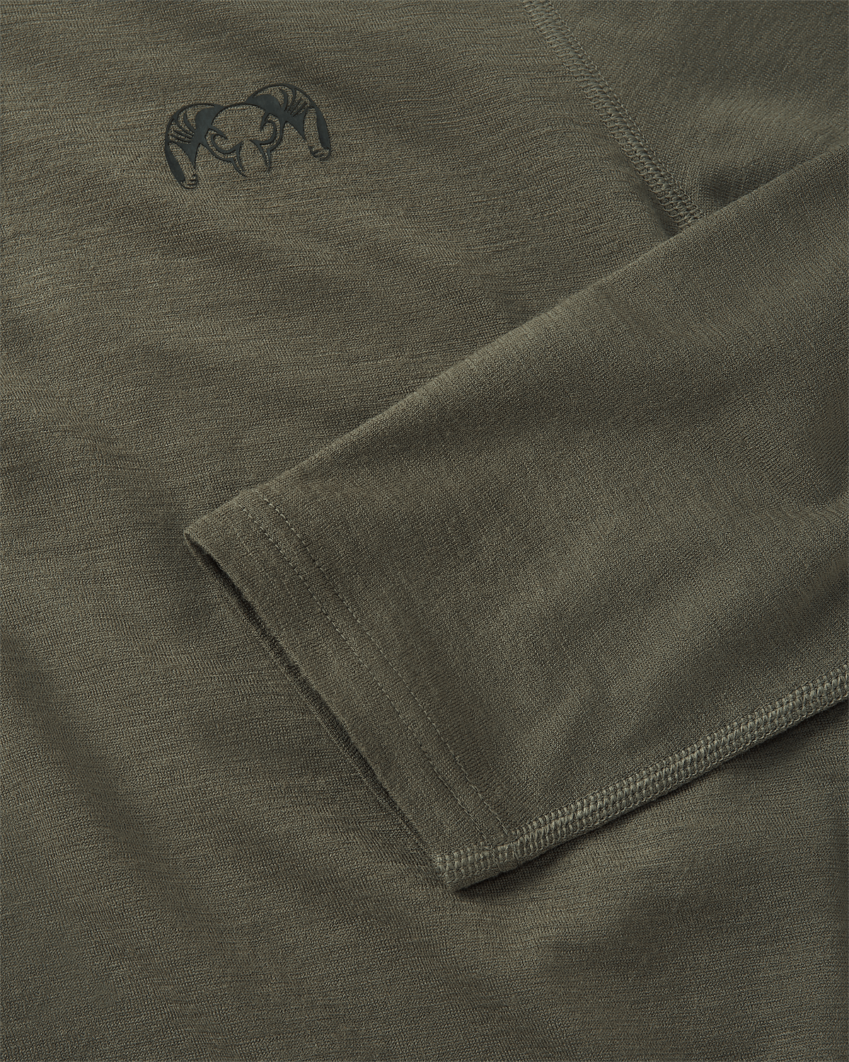 KUIU logo on the top left chest and flatlock stitching details on sleeve