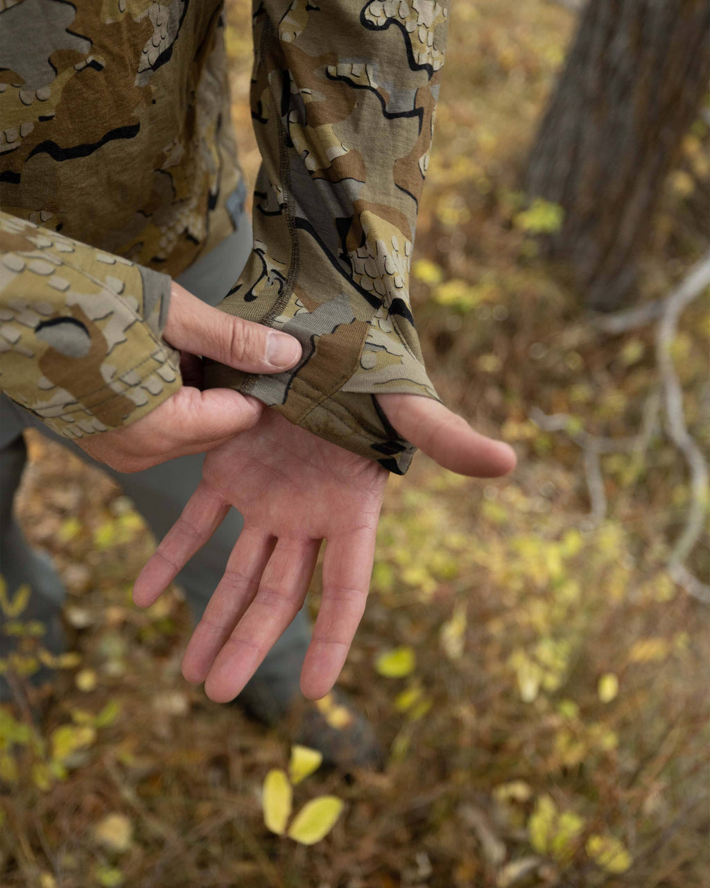 Close-up of Hunter's left palm faced up, Highlighting thumbhole in his sleeve