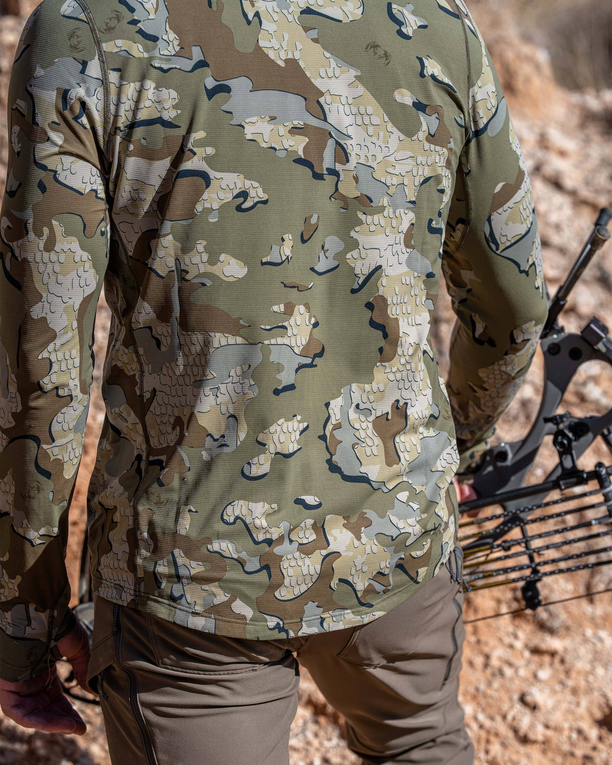 Back view of Hunter wearing Vital S1 Long Sleeve Crew in Valo Camouflage