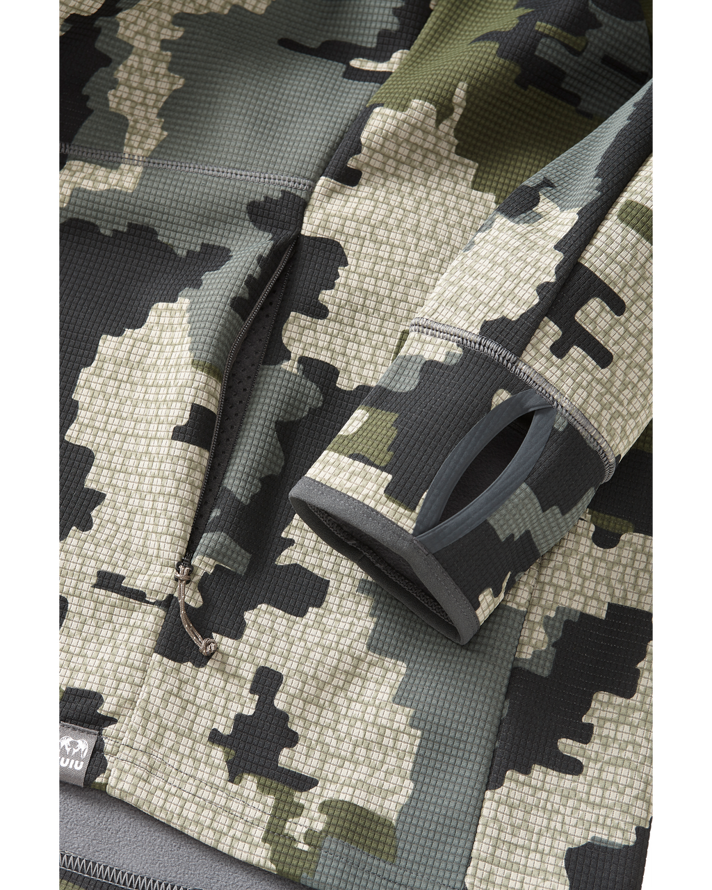 Detail area of zippered pocket, cuff, and thumbhole on Peloton 240 Full Zip in Verde Camouflage