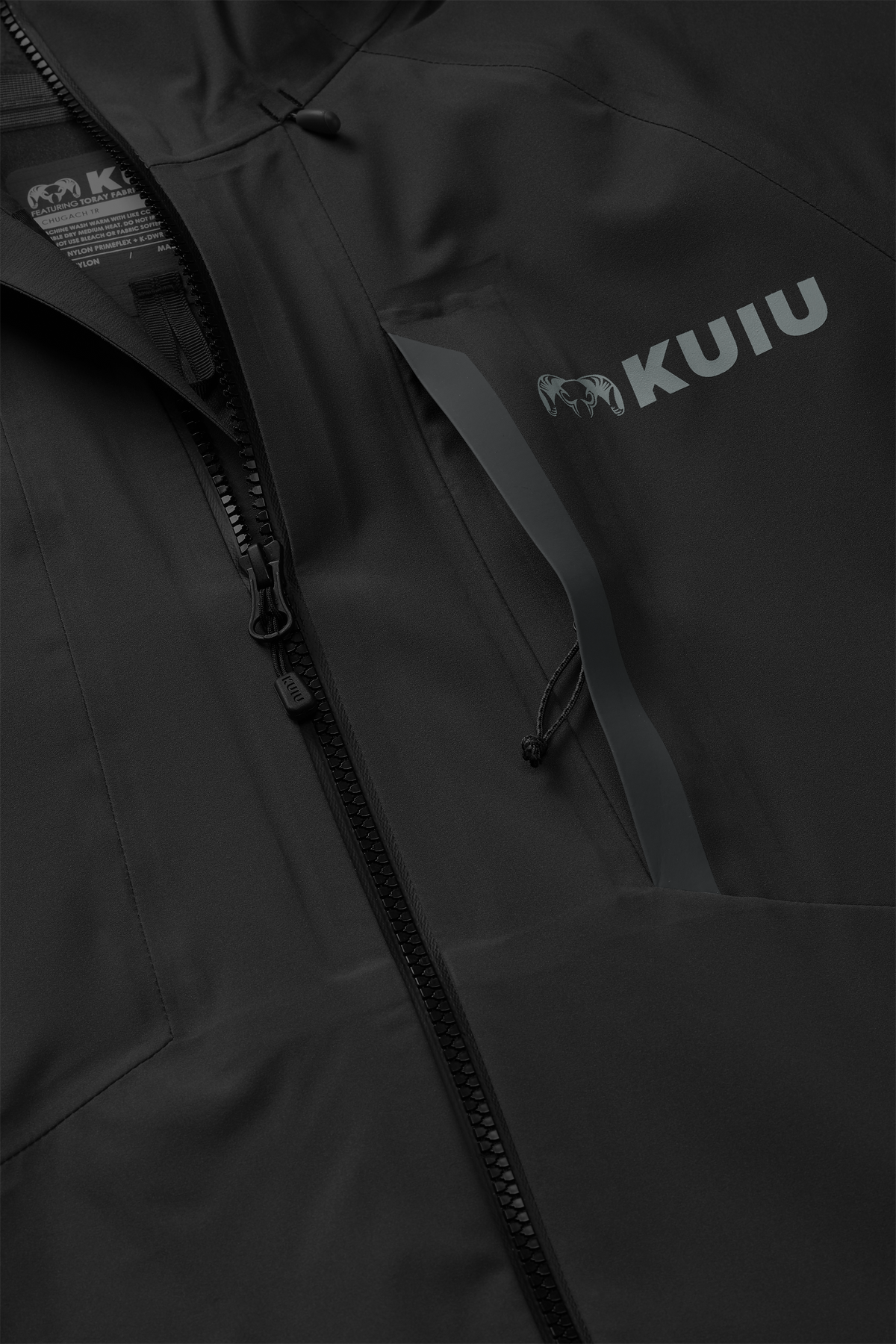 Detail of partially open zippered chest pocket on Chugach TR Rain Jacket in Black