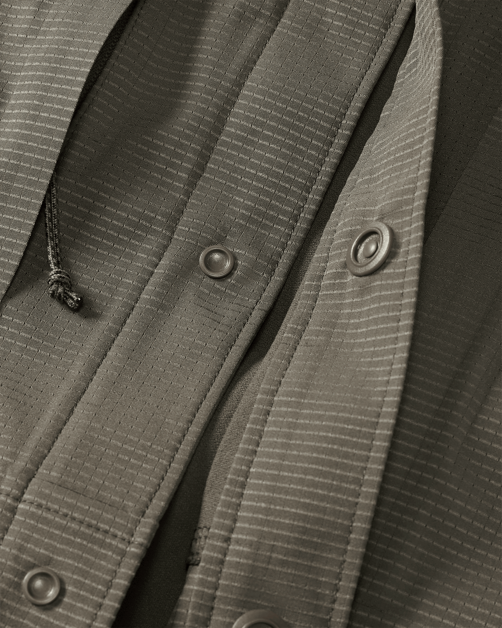 Front of unsnapped buttons on Tiburon Hybrid Snap Shirt in Ash Brown