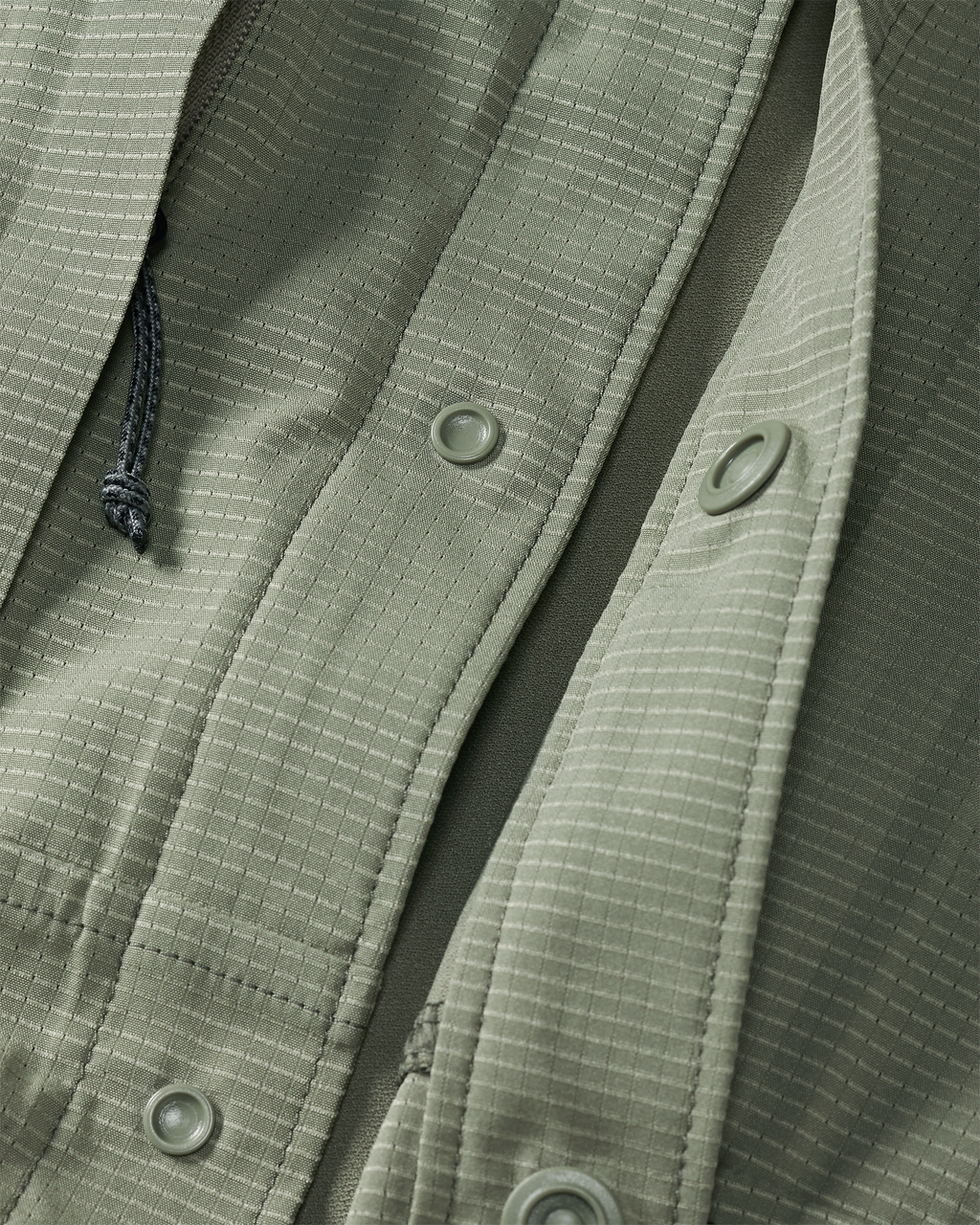 Front of unsnapped buttons on Tiburon Hybrid Snap Shirt in Buckbrush Sage