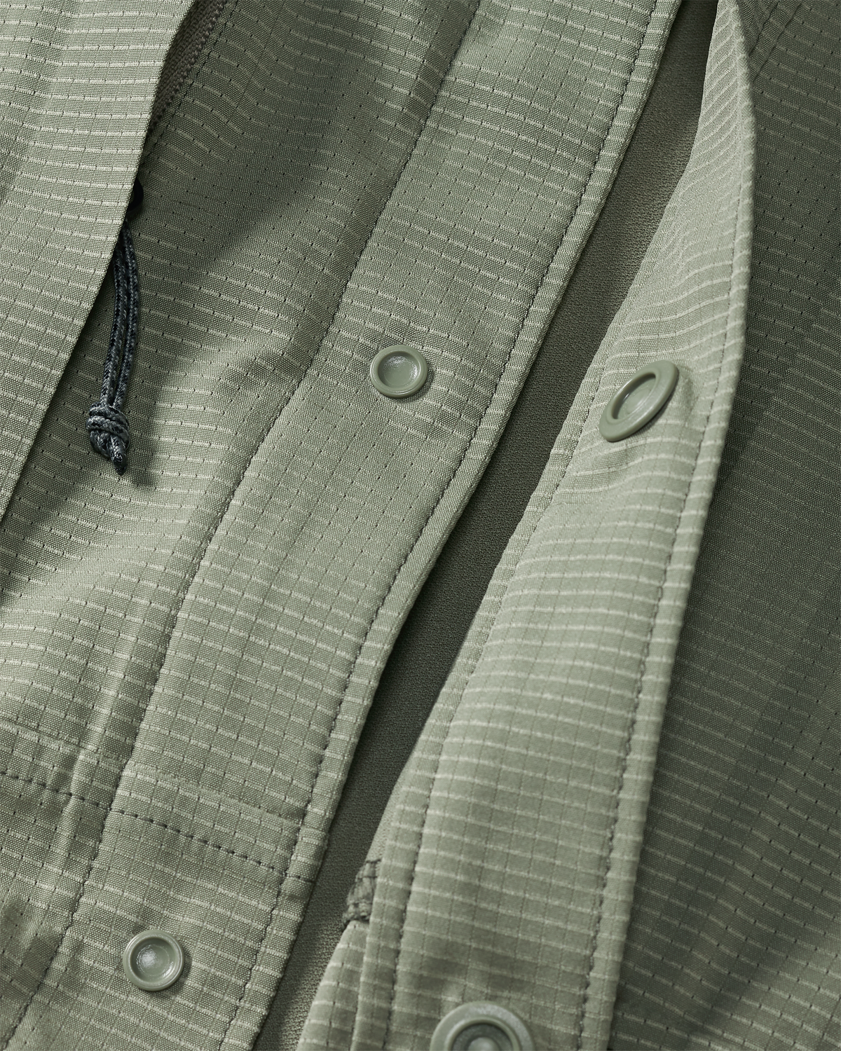 Front of unsnapped buttons on Tiburon Hybrid Snap Shirt in Buckbrush Sage