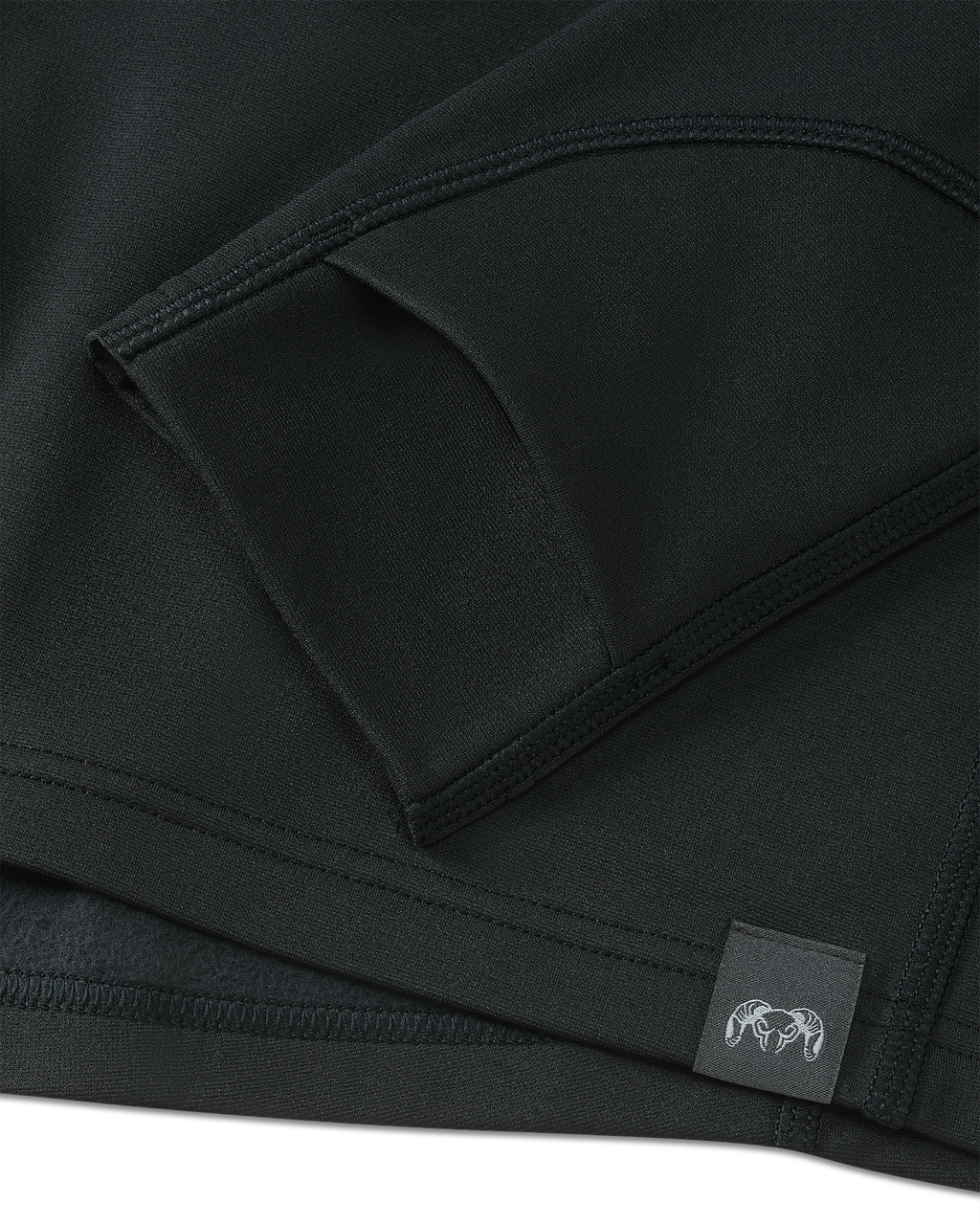 Detail of layered thumbhole on Vital S3 Long Sleeve Crew in Black