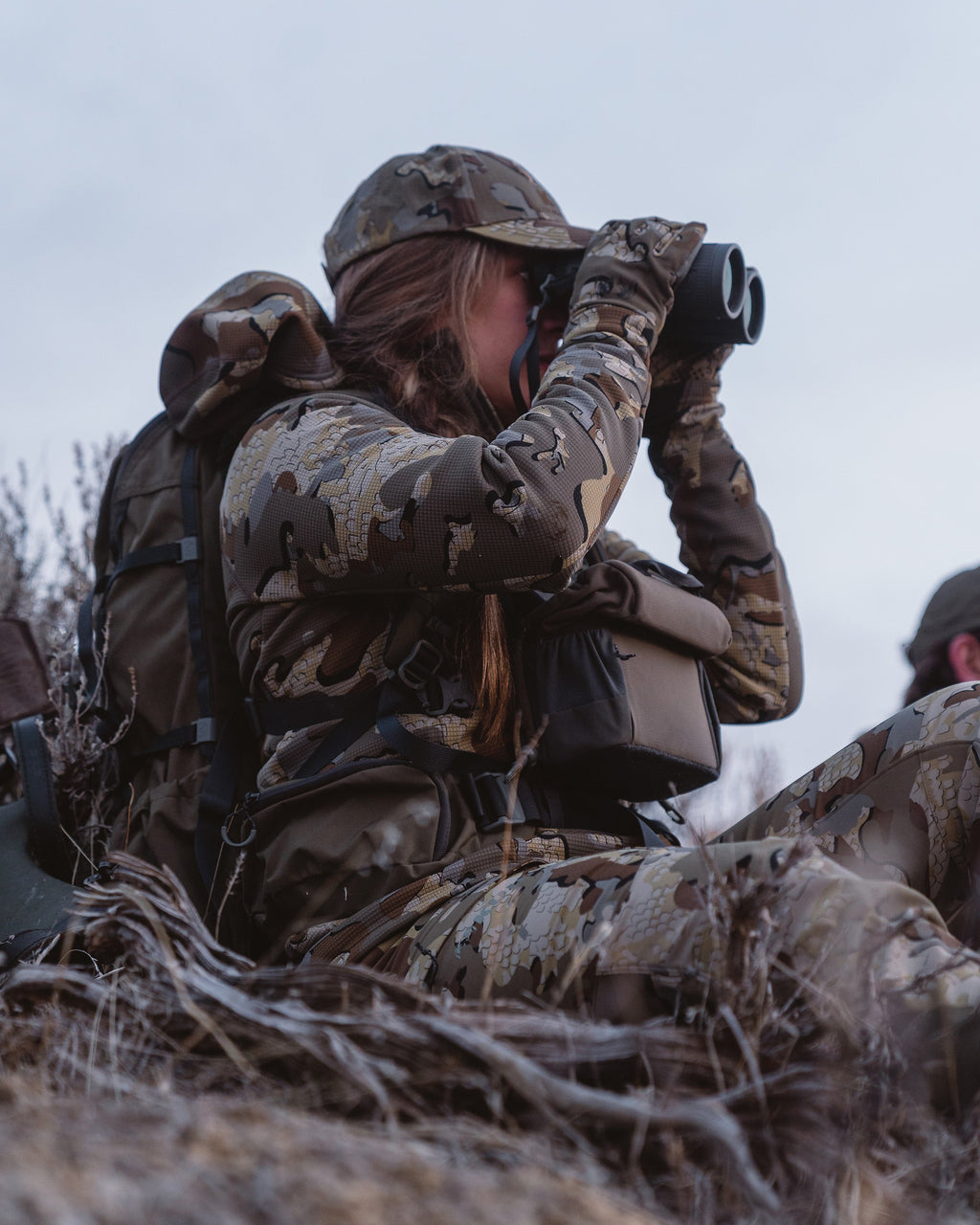Side of Hunter Glassing Game Wearing Peloton 240 Full Zip Hoodie in Valo Camouflage