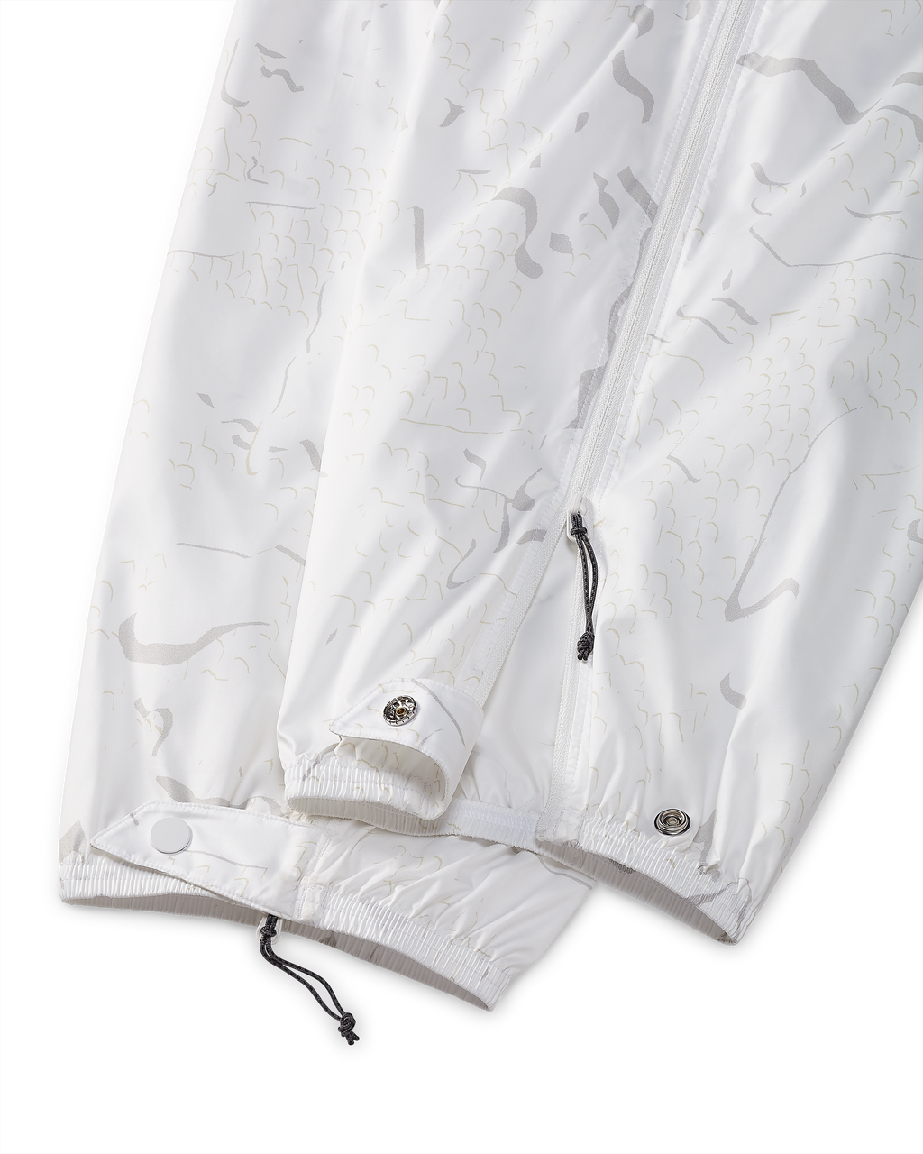 Detail of bottom leg elastic stretch cuffs with secure snap buttons on Snowfall Overwhites Pant