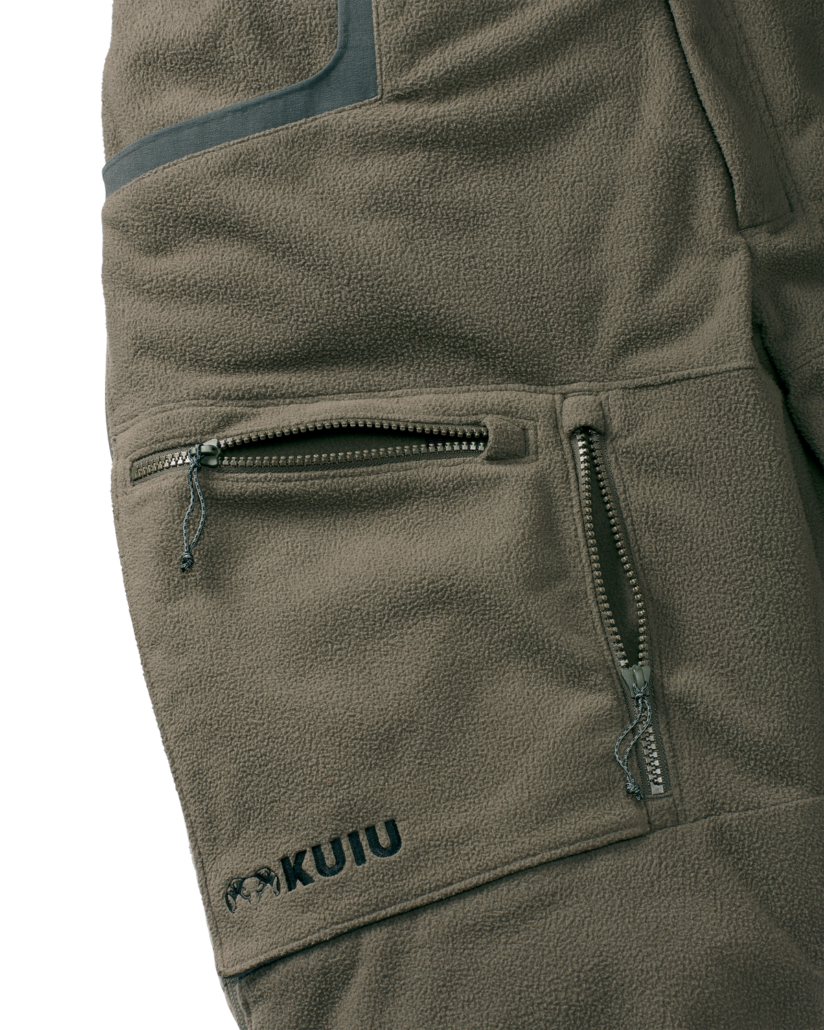 Close-up view of front zippered dual-compartment cargo pockets on the Proximity Insulated Pant in Ash Brown