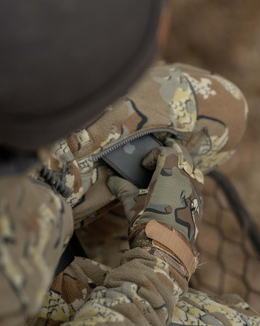 Aerial View of Hunter Wearing Proximity Insualted Pants in Valo Off-Shade Camouflage Highlighting Strategically Placed YKK Zippered Thigh Pockets