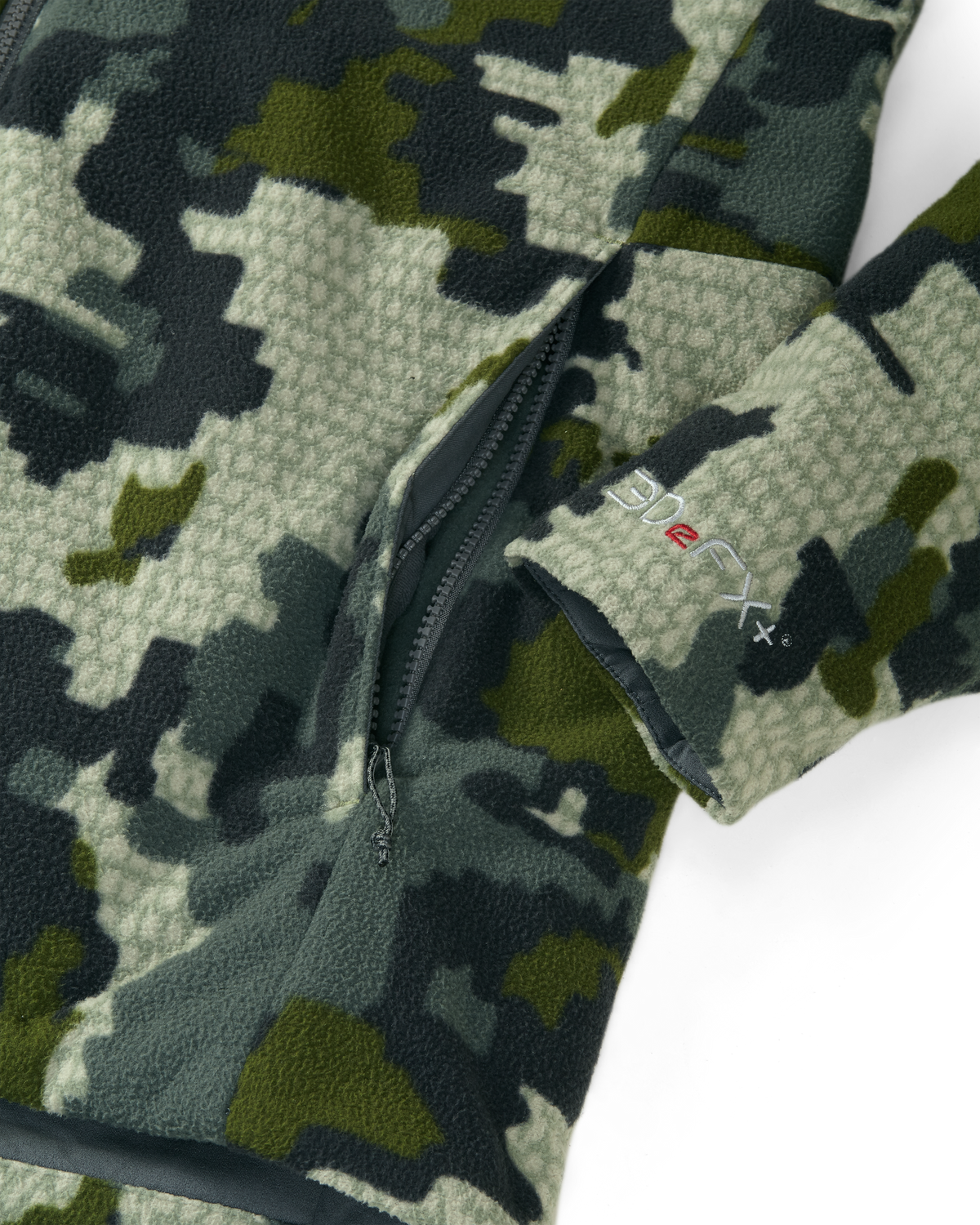 Close-up of zippered hand pockets, highlighting 3DeFX embroidered on wrist cuffs