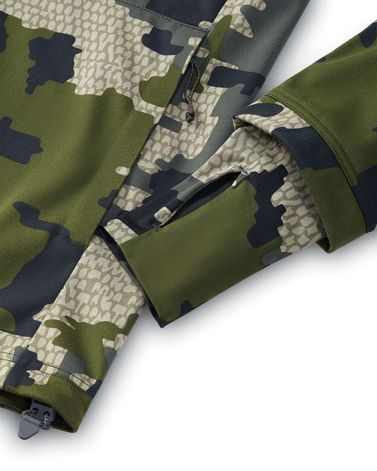 Detail of gasket wrist cuffs with thumbholes on the Drawpoint Hoodie in Verde camouflage.