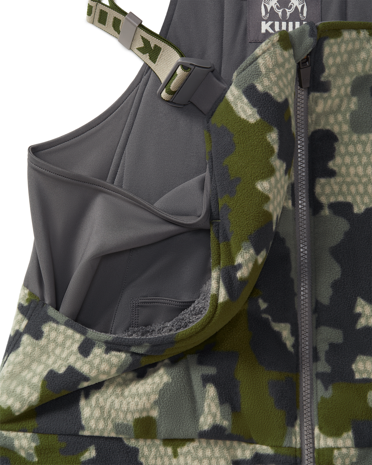 Close-up of a KUIU Proximity Insulated Bib in Verde camouflage highlighting sherpa fleece-lined upper hand warmer pockets.