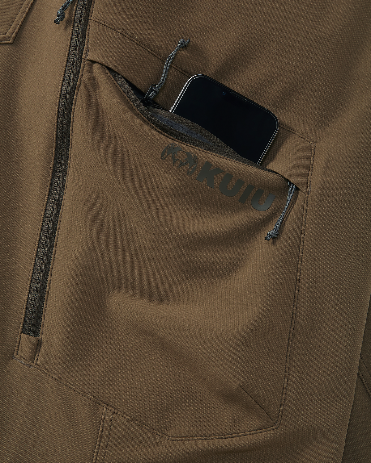 Close-up of Mesh Hip Vents and Zippered Cargo Pocket on the Attack Pant in Grizzly Brown